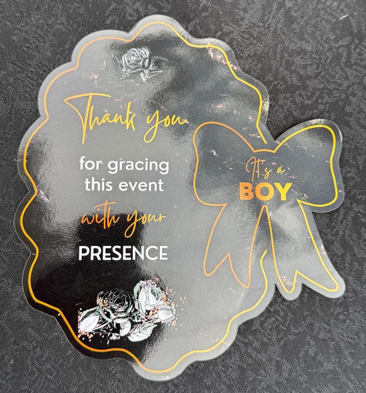 Acrylic welcome sign reading It's a Boy with white roses